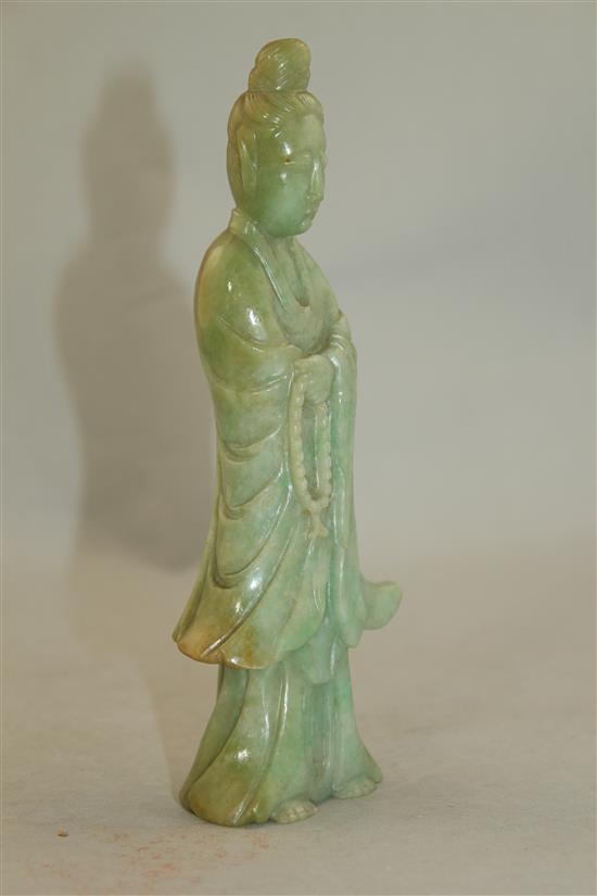 A Chinese jadeite standing figure of Guanyin, early 20th century, MEASUREMENT, wood stand